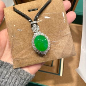 Full green pigeon egg pendant