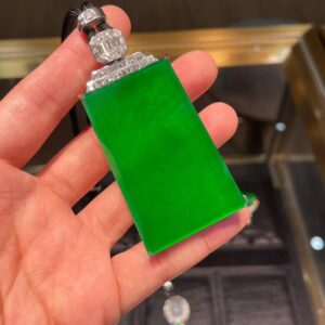 Rectangular emerald pendant with a solid green design